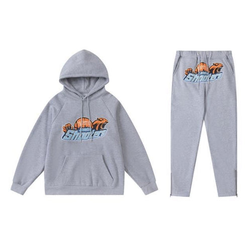 Conjunto trapstar shooters gris/naranjo
